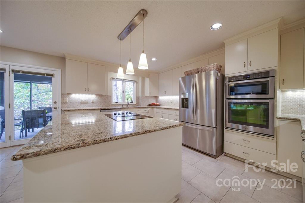 105 Den Road Wadesboro, NC 28170 - Photo 17 of 47 a kitchen with refrigerator and microwave