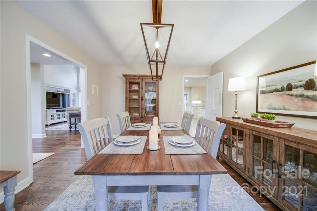 105 Den Road Wadesboro, NC 28170 - Photo 25 of 47 a view of a dining room with furniture and a chandelier