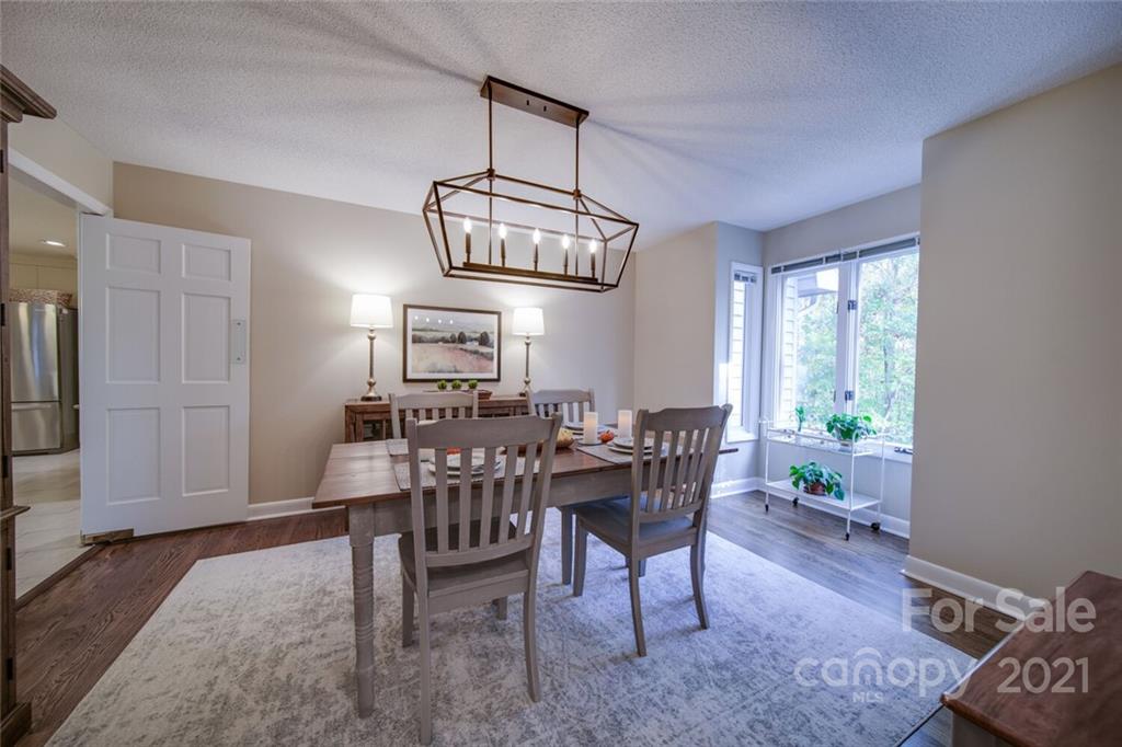 105 Den Road Wadesboro, NC 28170 - Photo 26 of 47 a view of a dining room with furniture window and wooden floor