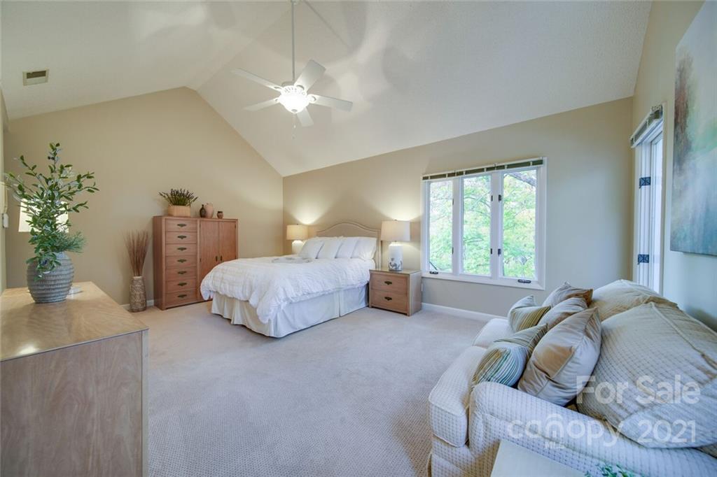 105 Den Road Wadesboro, NC 28170 - Photo 31 of 47 a spacious bedroom with a bed and a couch