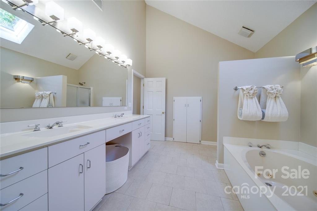 105 Den Road Wadesboro, NC 28170 - Photo 34 of 47 a spacious bathroom with a tub sink and mirror