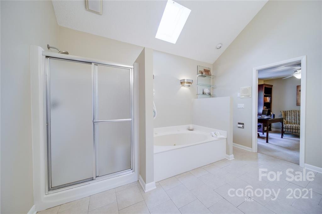 105 Den Road Wadesboro, NC 28170 - Photo 35 of 47 a en suite spacious bathroom with a tub shower and bedroom