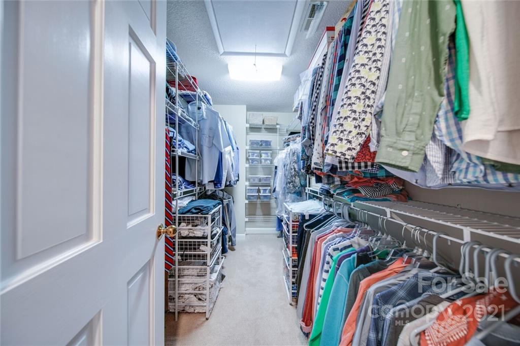 105 Den Road Wadesboro, NC 28170 - Photo 36 of 47 a view of walk in closet with clothes