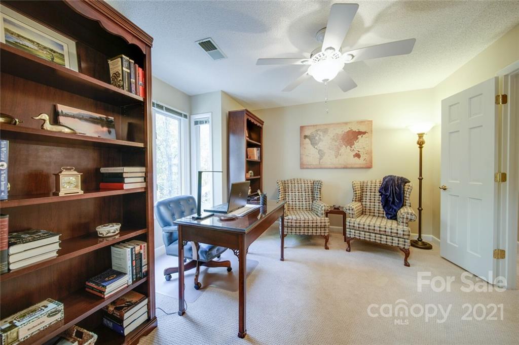105 Den Road Wadesboro, NC 28170 - Photo 38 of 47 a living room with furniture and a book shelf