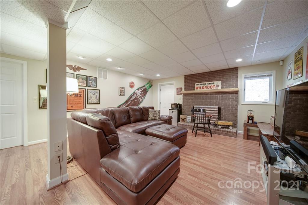 105 Den Road Wadesboro, NC 28170 - Photo 42 of 47 a living room with furniture a flat screen tv and a table