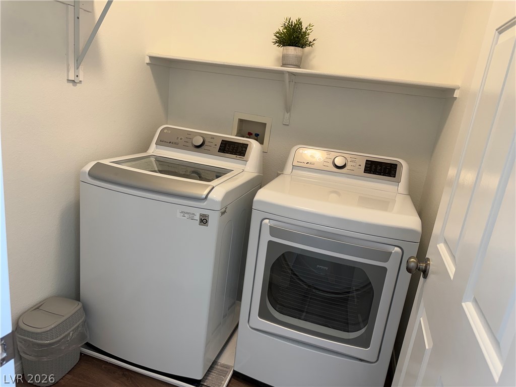 1141 Cathedral Ridge Street Henderson, NV 89052 - Photo 63 of 77 This dedicated laundry space offers convenience with its functional layout.