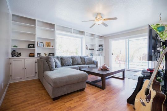 246 Peg Street Ridgecrest, CA 93555 - Photo 10 of 30 a living room with furniture and a flat screen tv