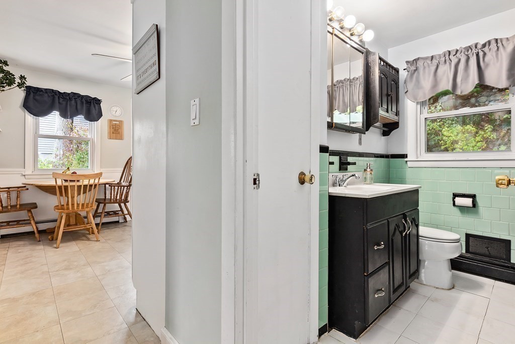 195 Den Quarry Road Lynn, MA 01904 - Photo 11 of 28 a bathroom with a sink vanity and a mirror