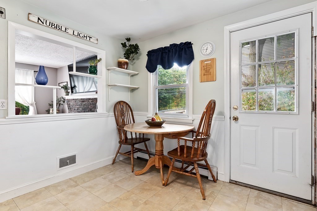195 Den Quarry Road Lynn, MA 01904 - Photo 16 of 28 a view of a dining room with furniture window and outside view