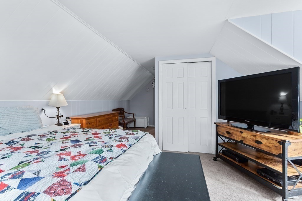195 Den Quarry Road Lynn, MA 01904 - Photo 18 of 28 a bedroom with a bed and a flat screen tv