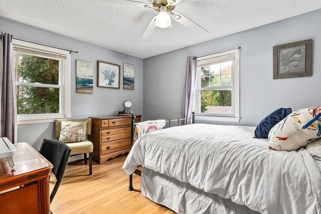 195 Den Quarry Road Lynn, MA 01904 - Photo 9 of 28 a bedroom with a bed and wooden floor