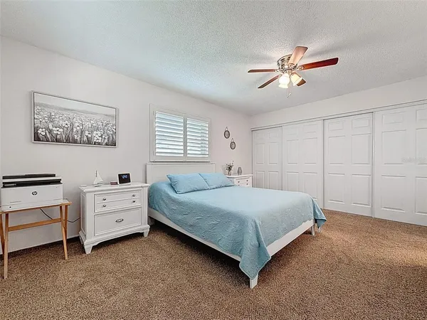 a bedroom with a bed and a cabinets