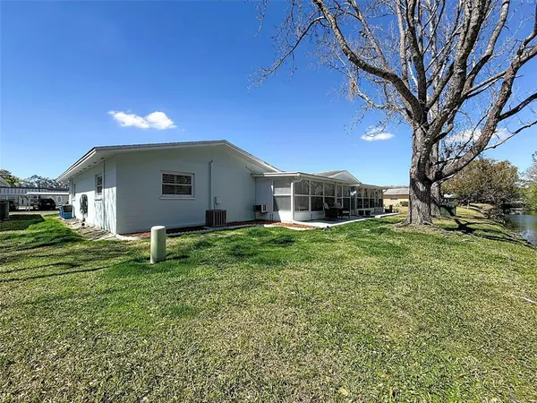 a view of an house with backyard space and garden