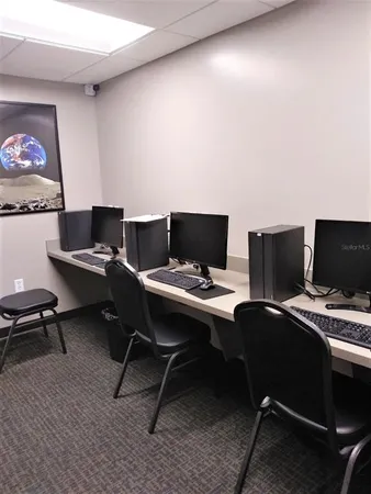 a view of a workspace with furniture