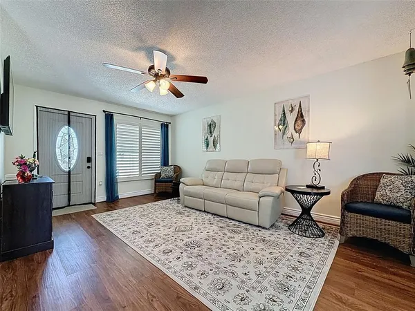 a living room with furniture and a rug