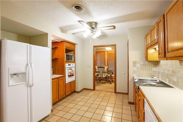 2282 Philadelphia Road Lebanon, TN 37087 - Photo 8 of 19 a kitchen with stainless steel appliances granite countertop a refrigerator and a stove top oven