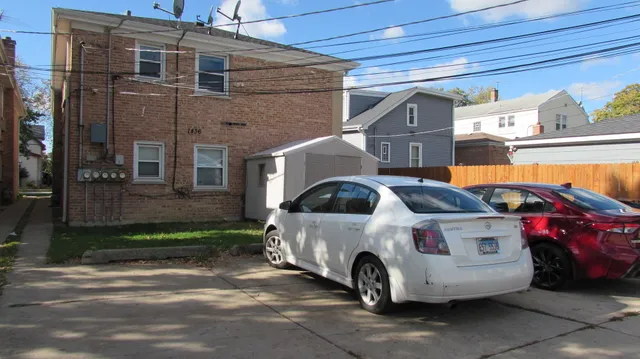 a front view of a house with parking space