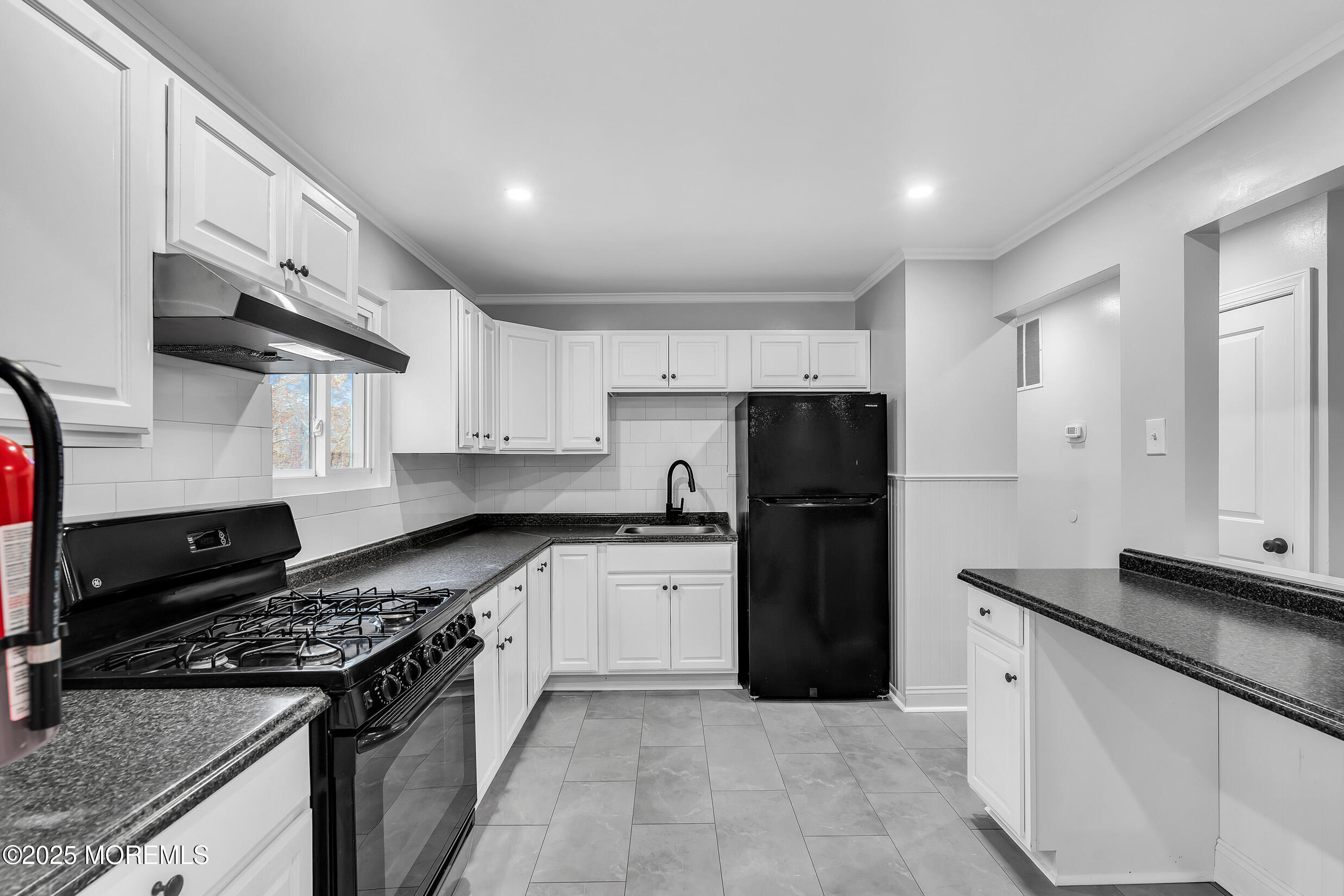 47 Beam Avenue Jackson, NJ 08527 - Photo 18 of 22 a kitchen with stainless steel appliances granite countertop a stove and a refrigerator