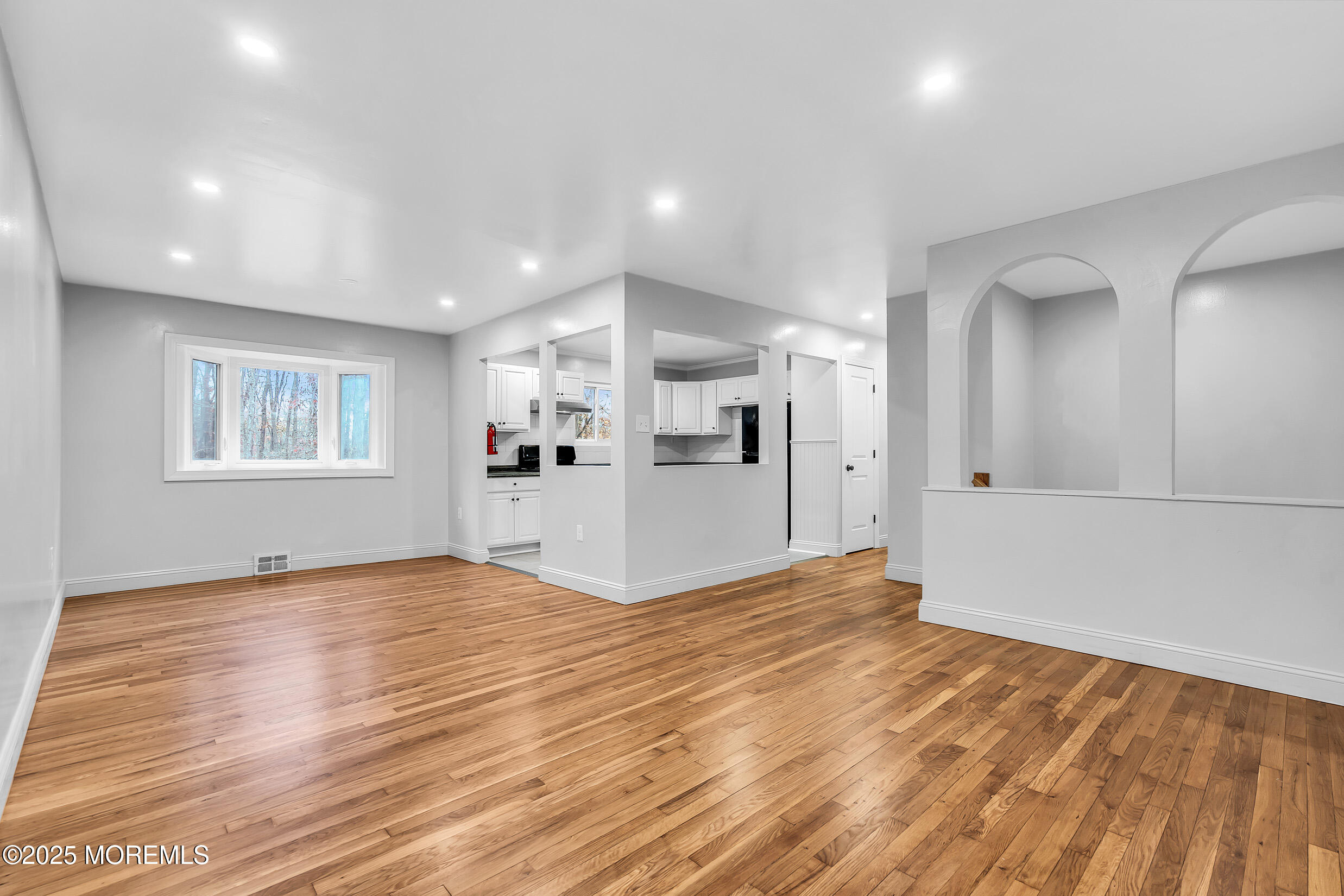 47 Beam Avenue Jackson, NJ 08527 - Photo 5 of 22 a view of empty room with wooden floor and windows