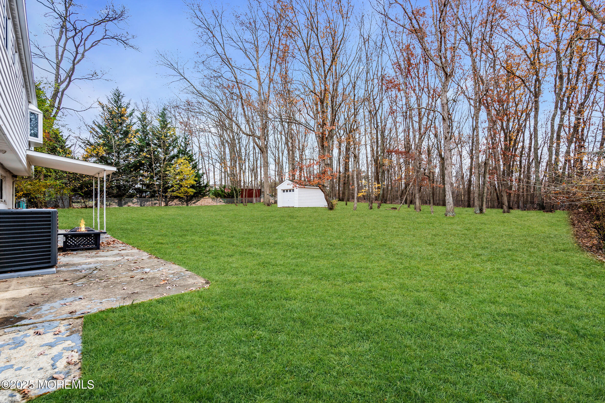 47 Beam Avenue Jackson, NJ 08527 - Photo 7 of 22 a view of a backyard with a garden