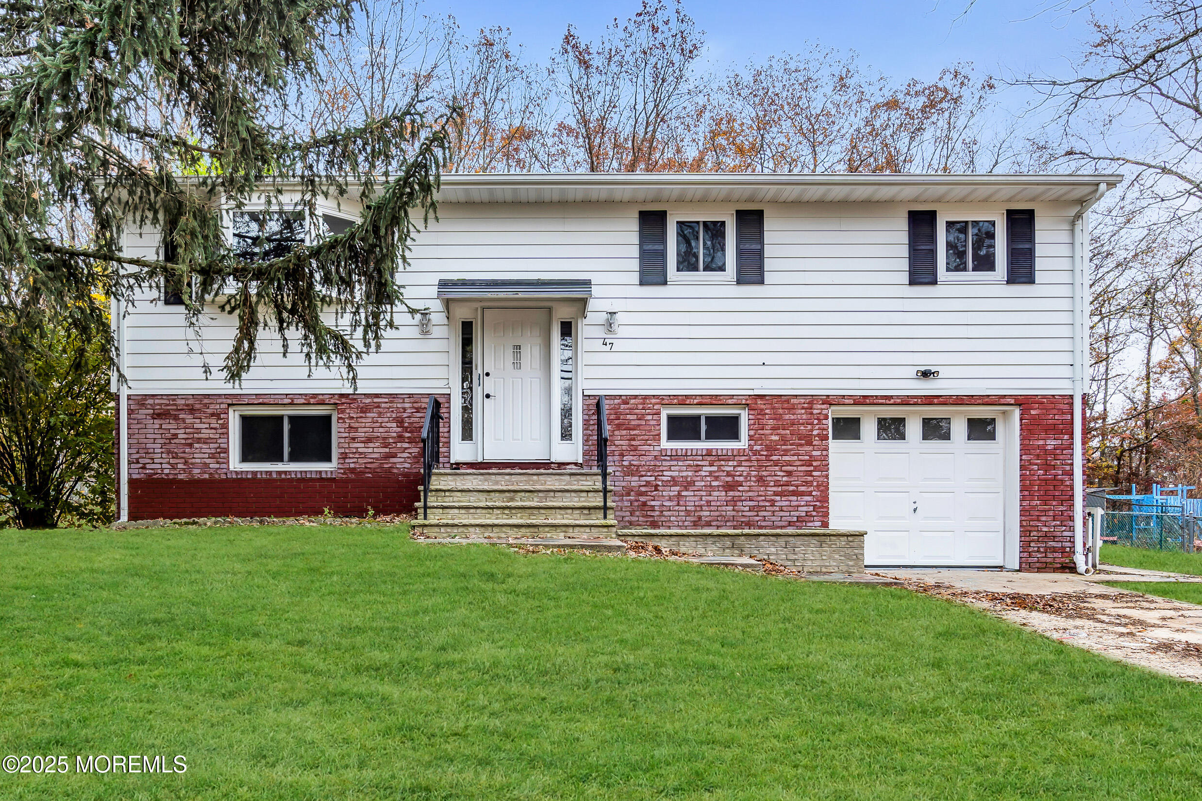 47 Beam Avenue Jackson, NJ 08527 - Photo 10 of 22 a front view of house with yard and garage