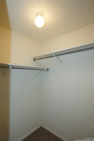 a view of a room with racks on the wall