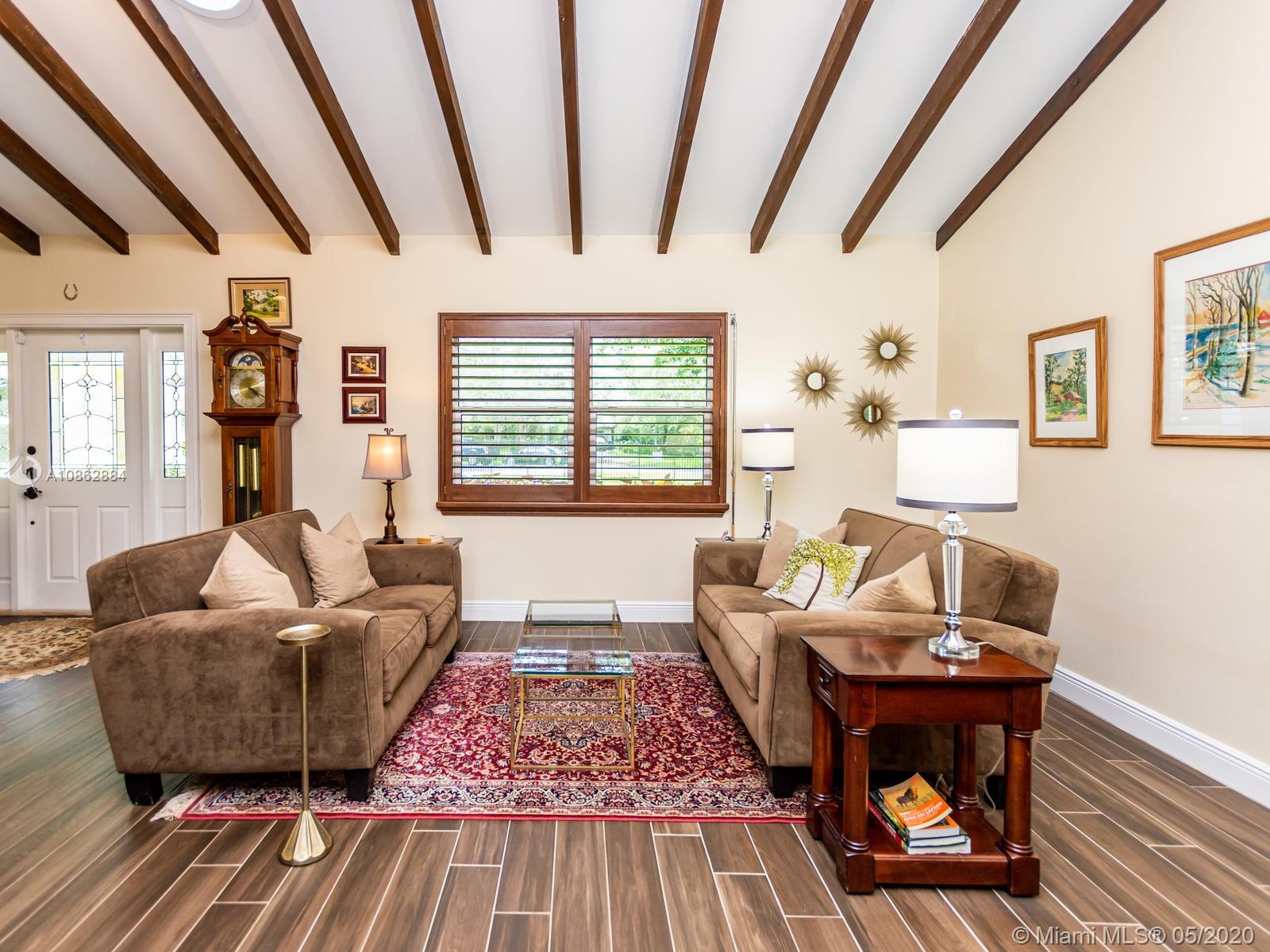 5130 Southwest 170th Avenue Southwest Ranches, FL 33331 - Photo 3 of 83 LIVING ROOM WITH EXPOSED WOOD BEAM VAULTED CEILINGS