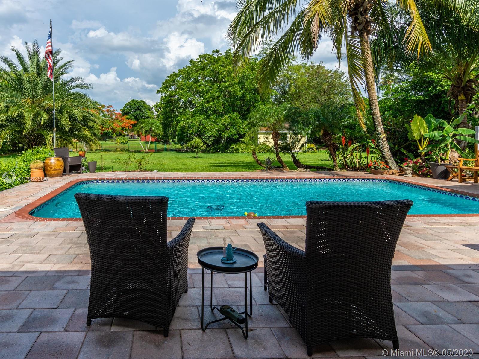 5130 Southwest 170th Avenue Southwest Ranches, FL 33331 - Photo 8 of 83 POOL AND PAVERED PATIO OVERLOOKING THE YARD.