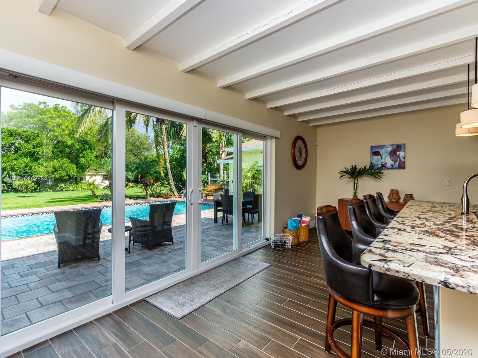 5130 Southwest 170th Avenue Southwest Ranches, FL 33331 - Photo 9 of 83 IMPACT GLASS DOORS TO THE POOL AND PATIO.
