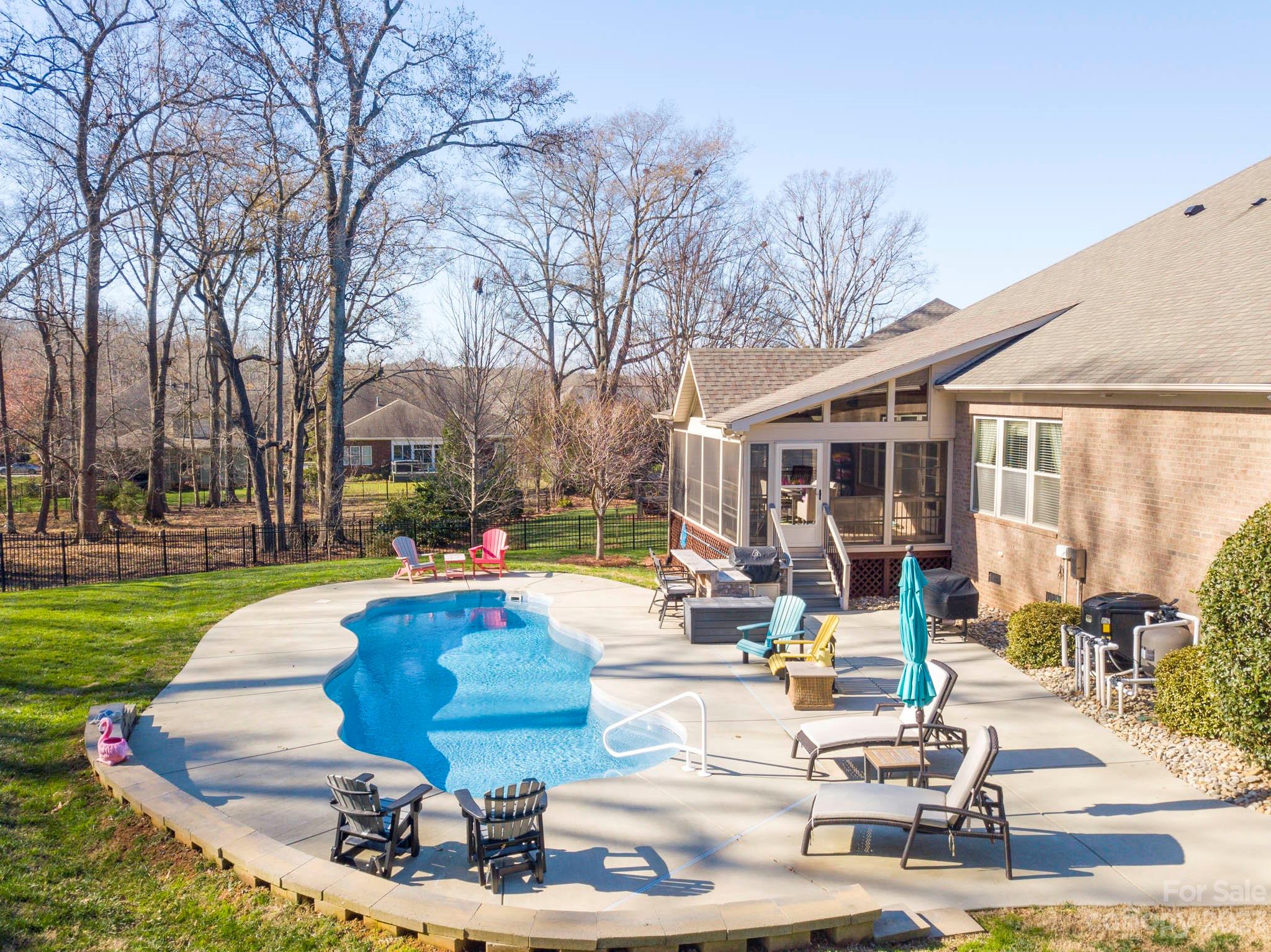 4226 Morris Park Drive, Unit 2 Mint Hill, NC 28227 - Photo 11 of 48 a view of a swimming pool with lounge chairs