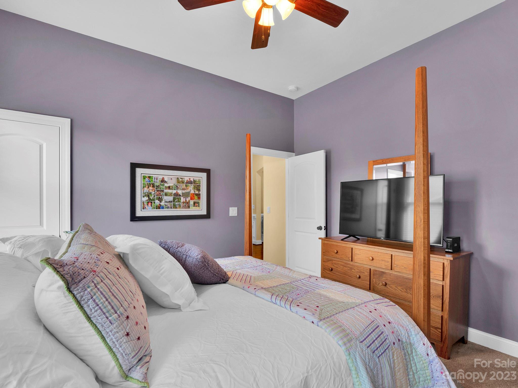 4226 Morris Park Drive, Unit 2 Mint Hill, NC 28227 - Photo 23 of 48 a bedroom with a bed and a flat screen tv