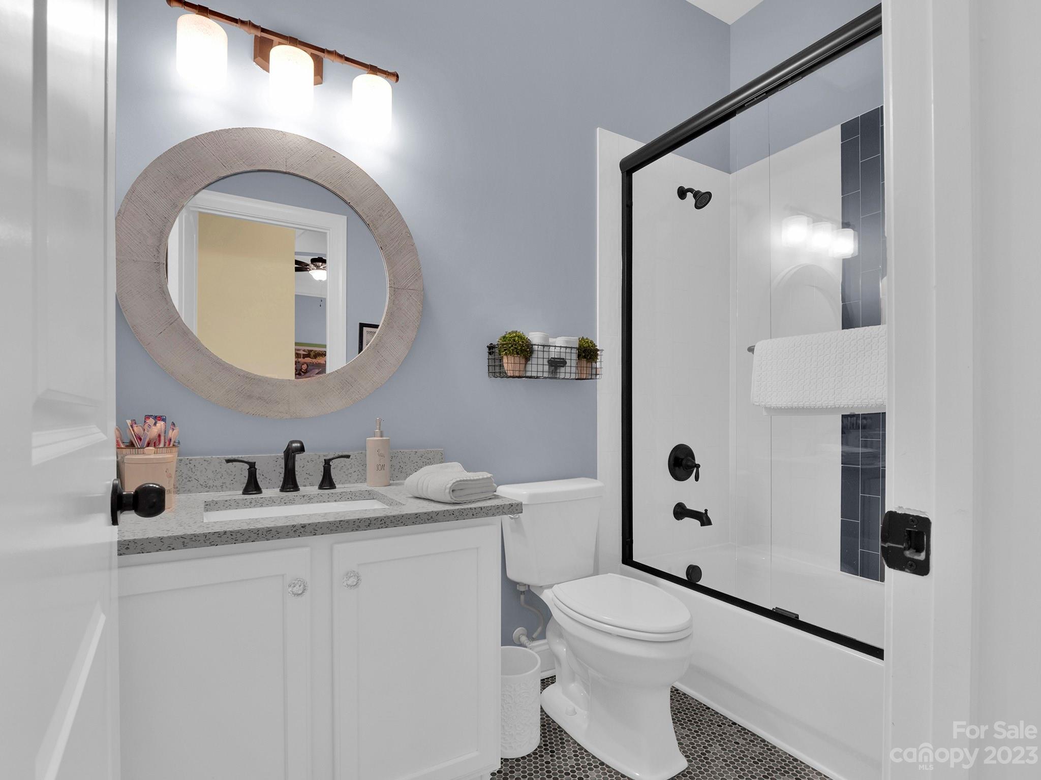 4226 Morris Park Drive, Unit 2 Mint Hill, NC 28227 - Photo 24 of 48 a bathroom with a toilet sink and mirror