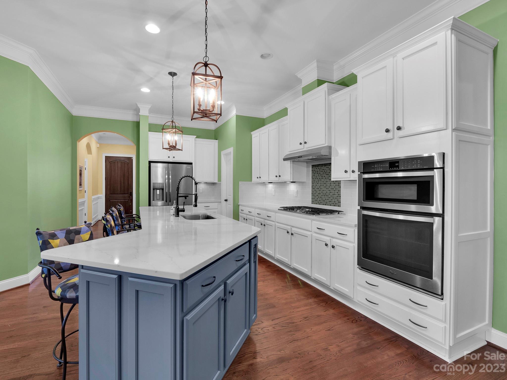 4226 Morris Park Drive, Unit 2 Mint Hill, NC 28227 - Photo 28 of 48 a kitchen with kitchen island granite countertop a sink cabinets and stainless steel appliances