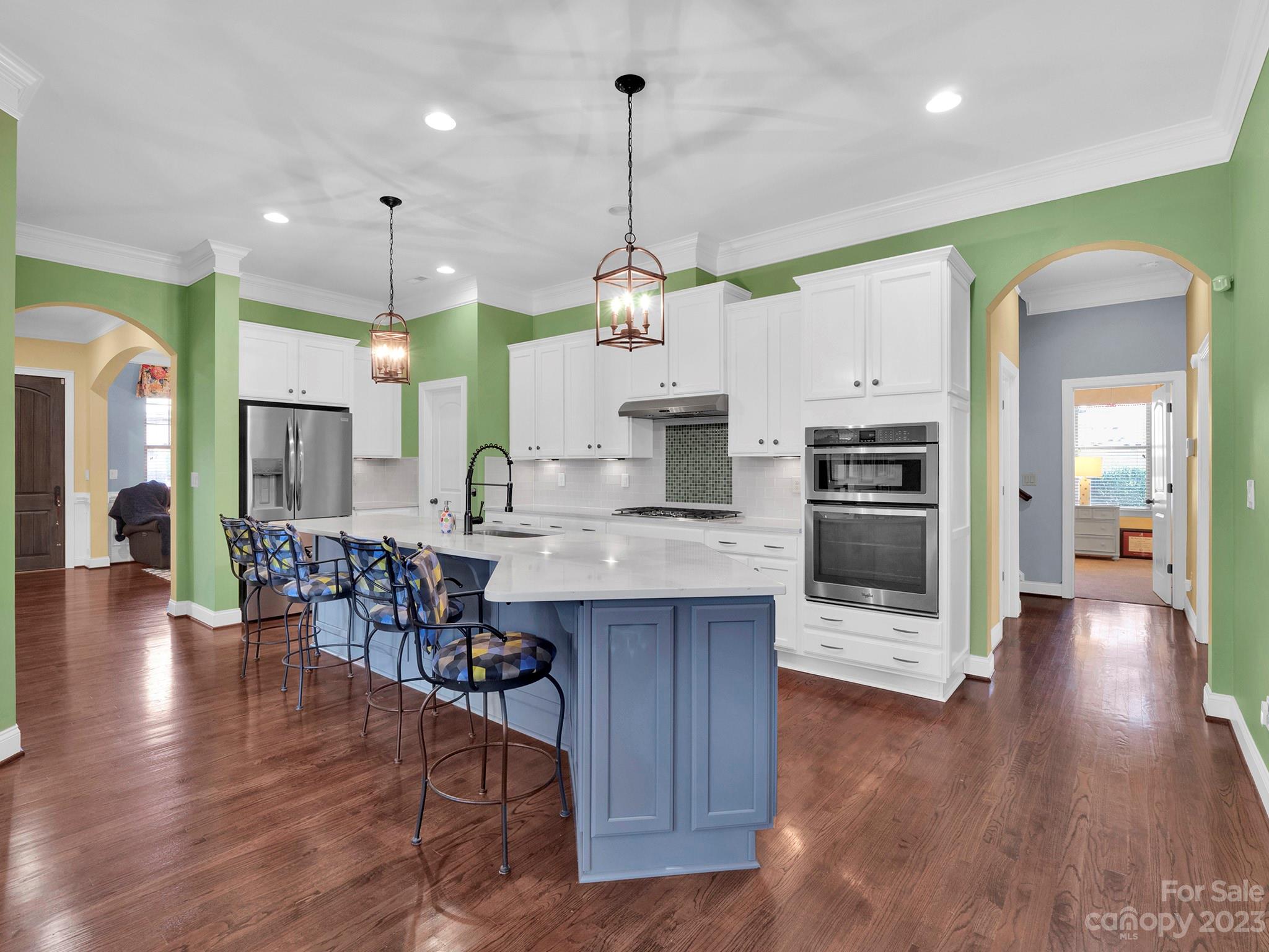 4226 Morris Park Drive, Unit 2 Mint Hill, NC 28227 - Photo 29 of 48 a large kitchen with lots of counter space dining table and stainless steel appliances