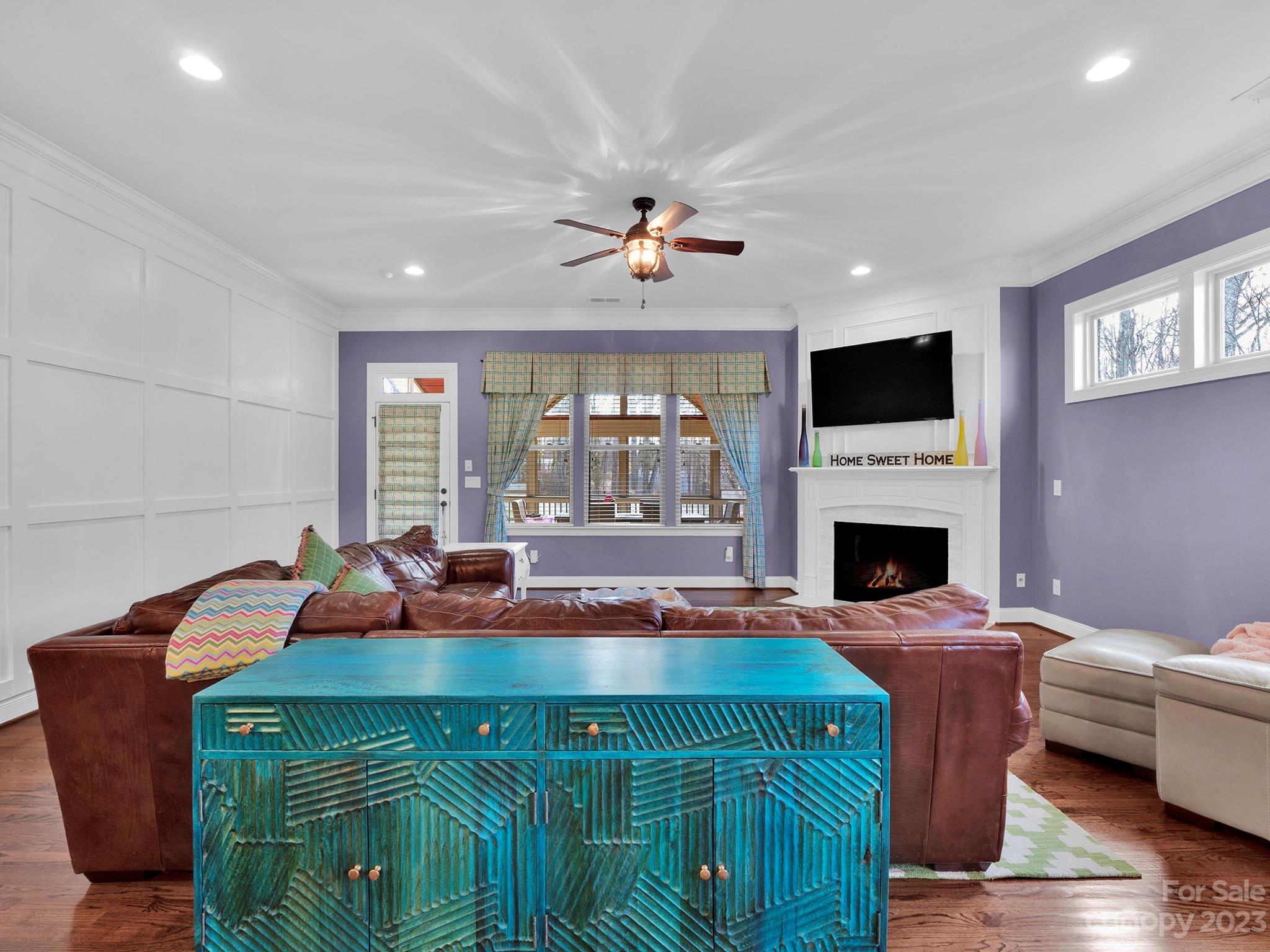 4226 Morris Park Drive, Unit 2 Mint Hill, NC 28227 - Photo 32 of 48 a living room with furniture a fireplace and a flat screen tv