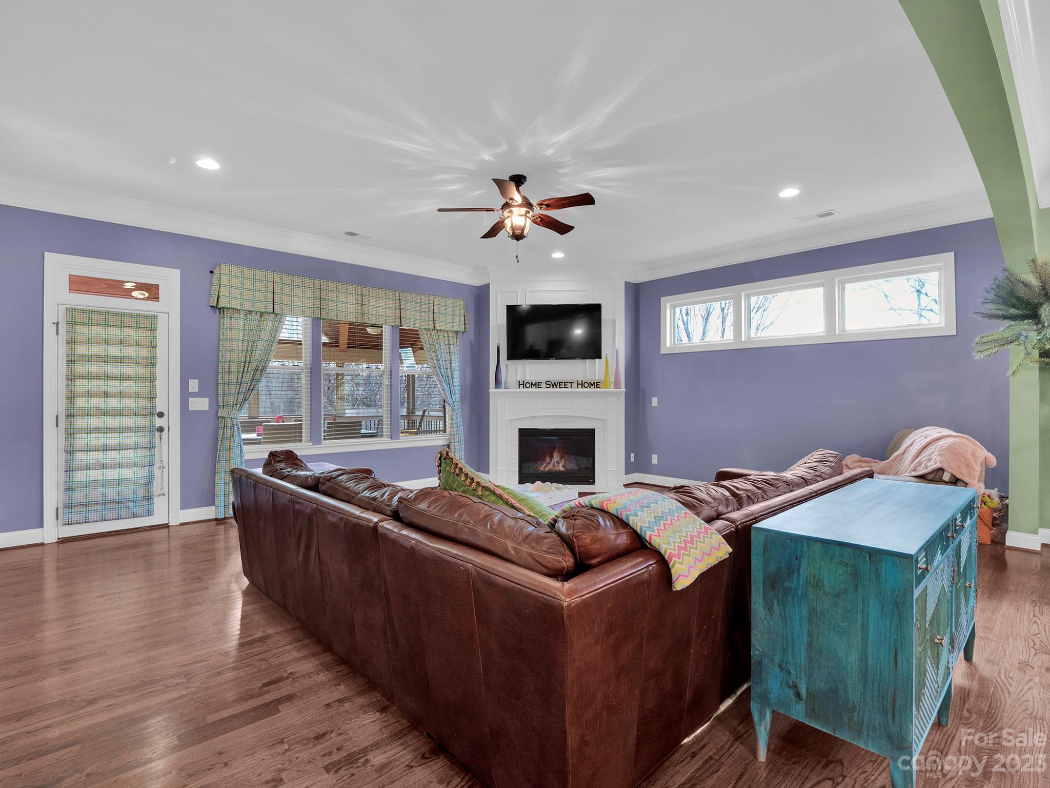 4226 Morris Park Drive, Unit 2 Mint Hill, NC 28227 - Photo 33 of 48 a living room with furniture a fireplace and a flat screen tv