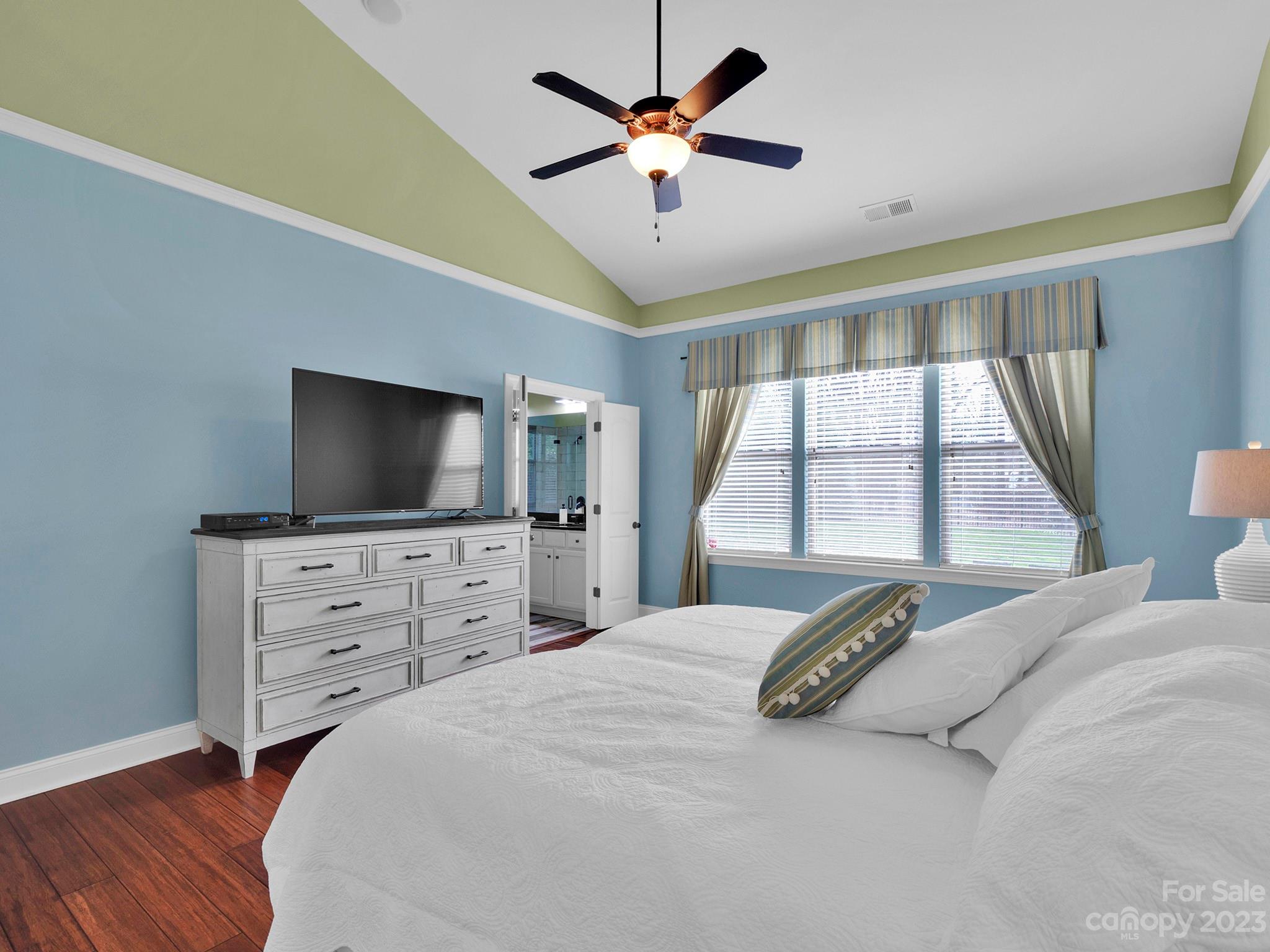 4226 Morris Park Drive, Unit 2 Mint Hill, NC 28227 - Photo 35 of 48 a bedroom with a large bed and a flat screen tv