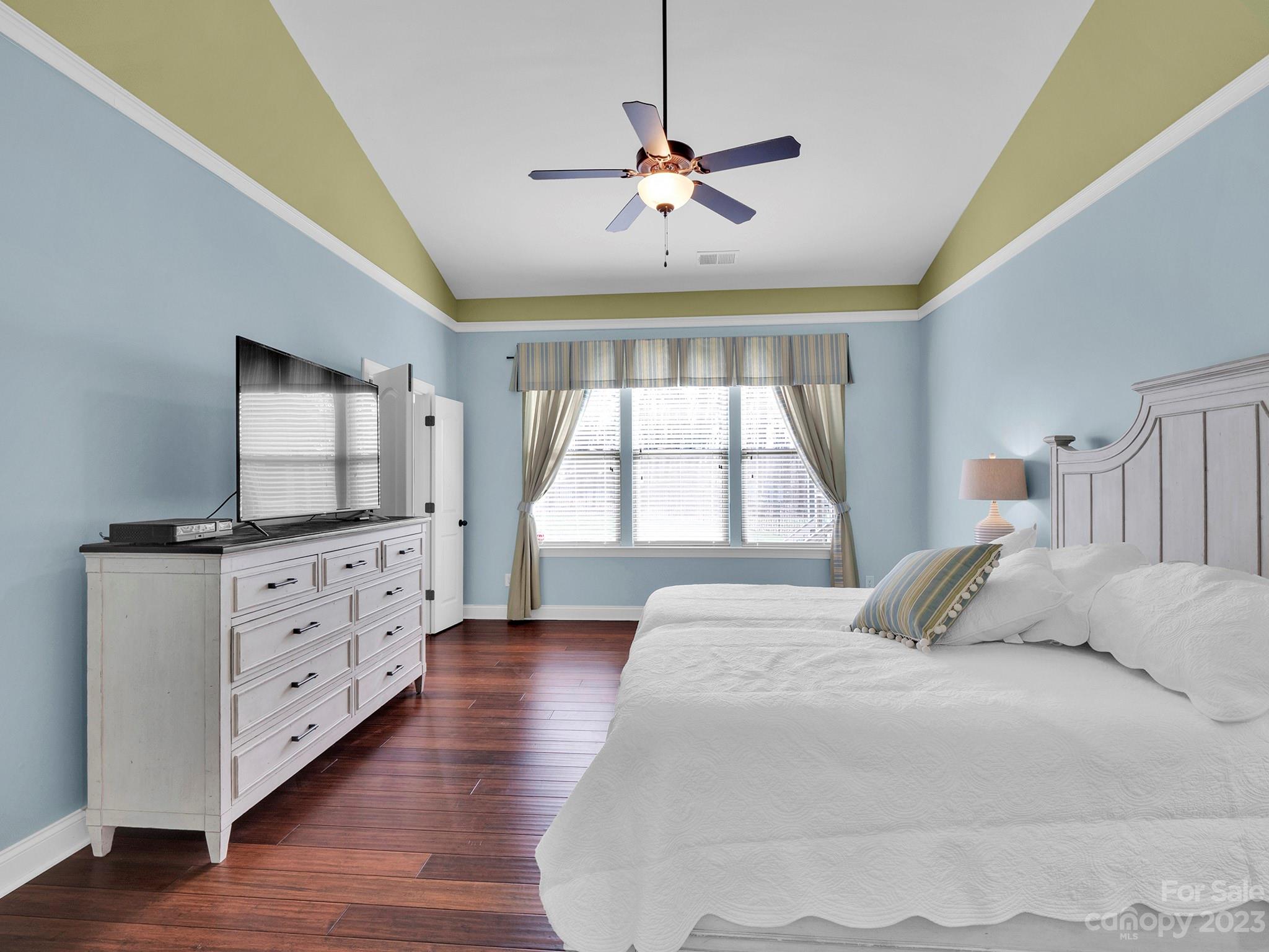 4226 Morris Park Drive, Unit 2 Mint Hill, NC 28227 - Photo 36 of 48 a bedroom with a large bed and a flat tv screen on dresser