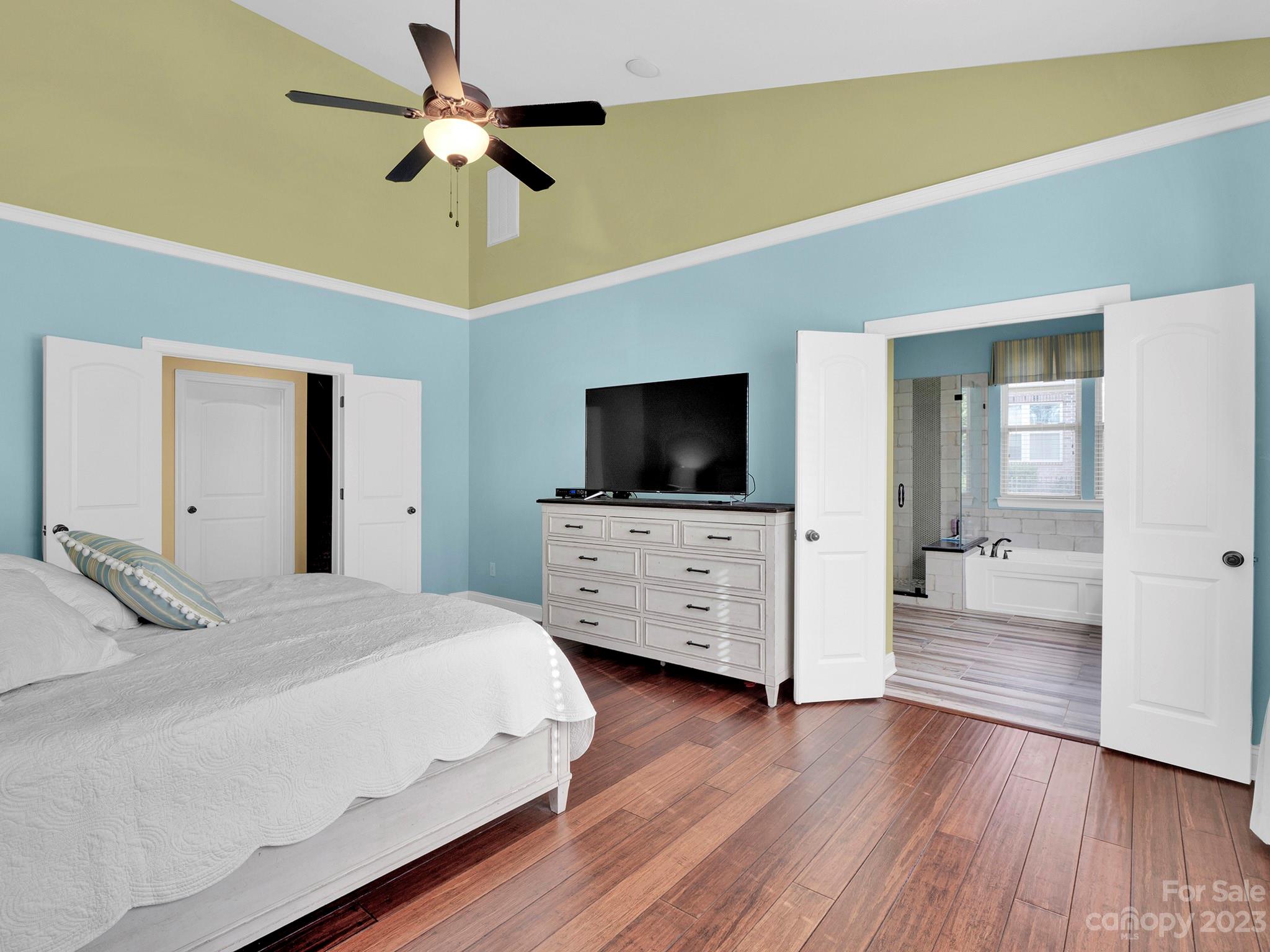 4226 Morris Park Drive, Unit 2 Mint Hill, NC 28227 - Photo 37 of 48 a bedroom with furniture and flat screen tv