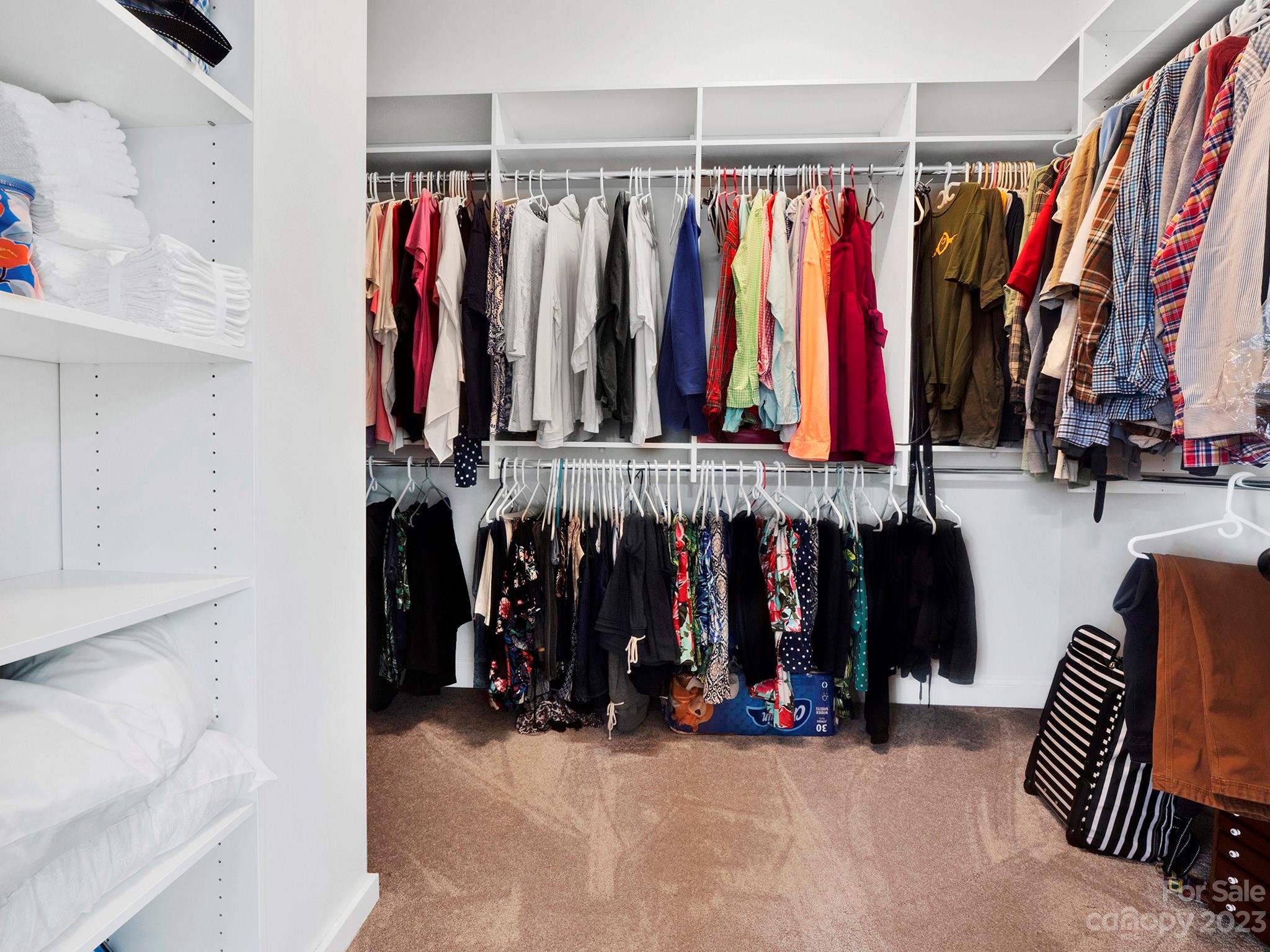 4226 Morris Park Drive, Unit 2 Mint Hill, NC 28227 - Photo 40 of 48 a view of walk in closet with clothes