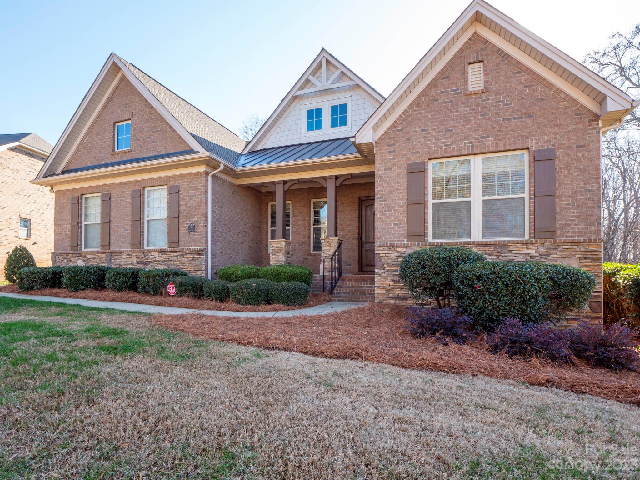 4226 Morris Park Drive, Unit 2 Mint Hill, NC 28227 - Photo 4 of 48 a front view of a house with yard and green space