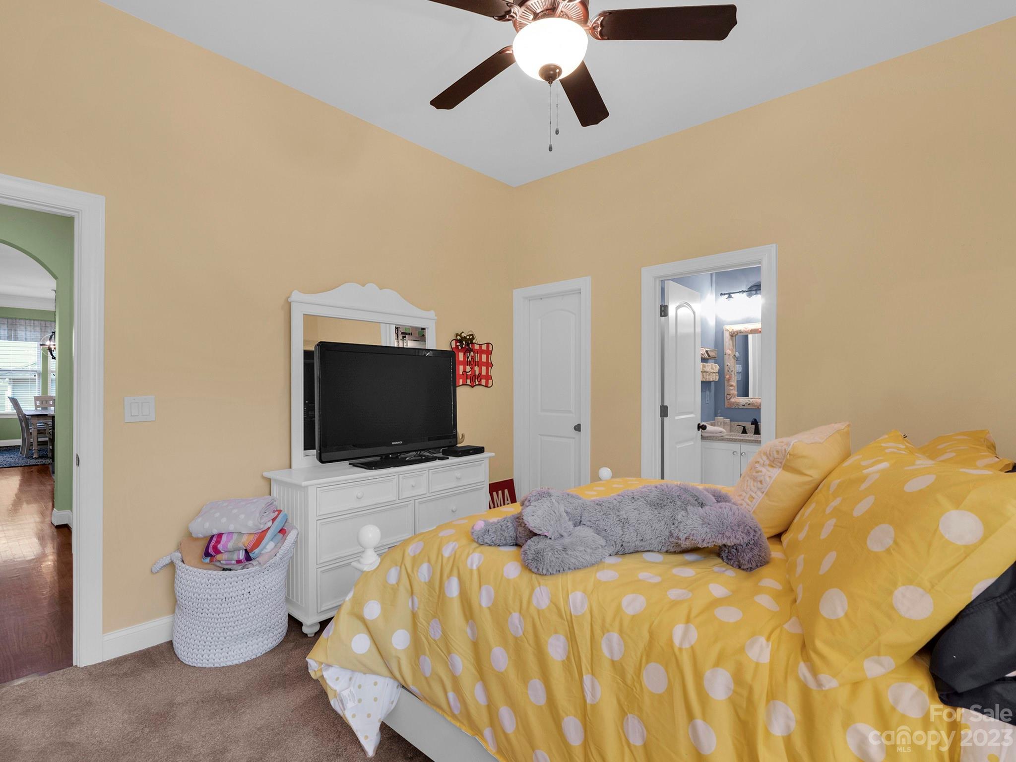 4226 Morris Park Drive, Unit 2 Mint Hill, NC 28227 - Photo 41 of 48 a bedroom with a bed and flat screen tv