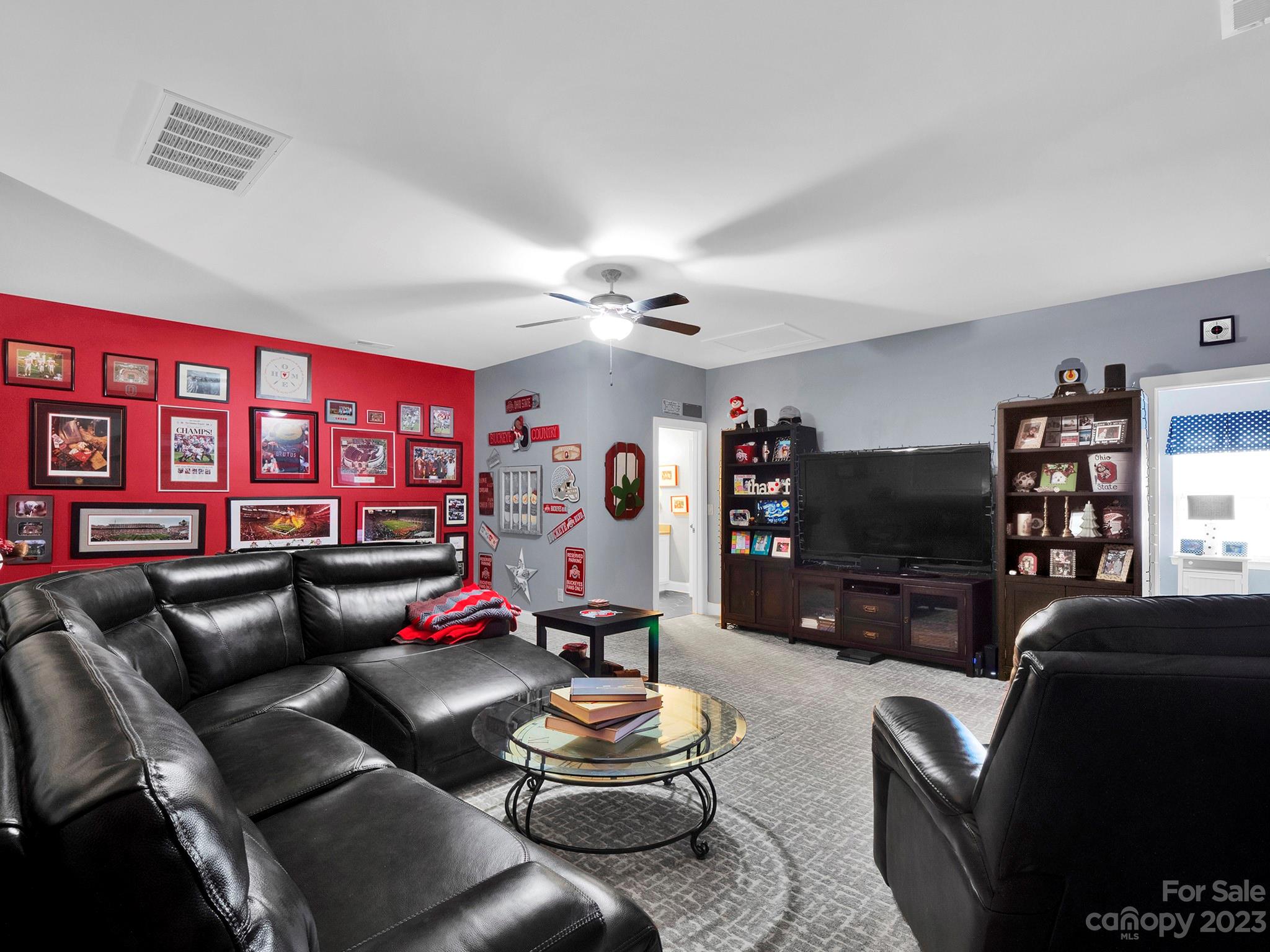 4226 Morris Park Drive, Unit 2 Mint Hill, NC 28227 - Photo 43 of 48 a living room with furniture and a flat screen tv