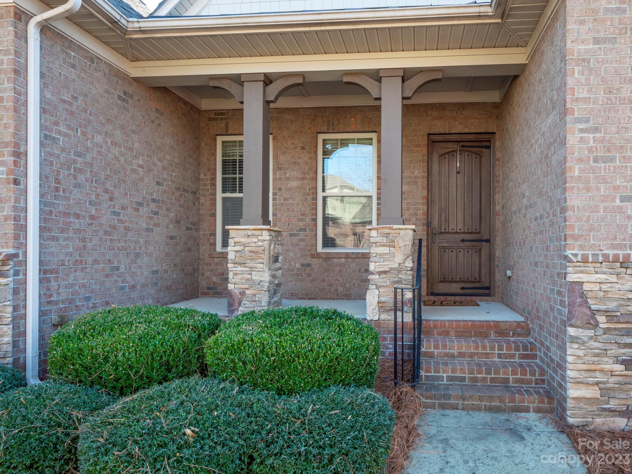 4226 Morris Park Drive, Unit 2 Mint Hill, NC 28227 - Photo 5 of 48 a front view of a house with a porch