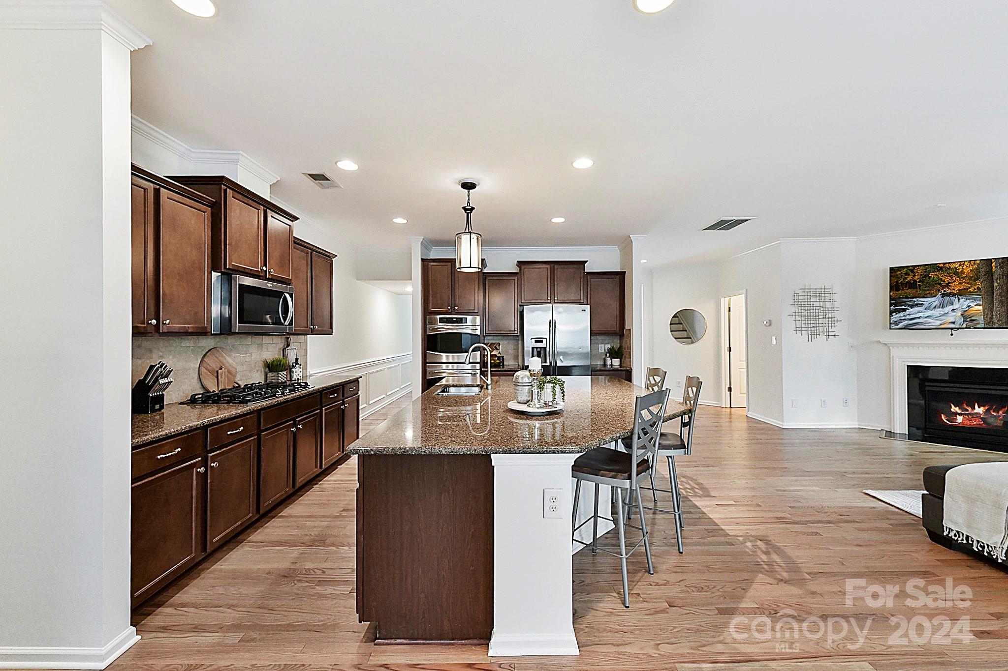 1201 Screech Owl Road Waxhaw, NC 28173 - Photo 13 of 43 a view of kitchen with sink and wooden floor