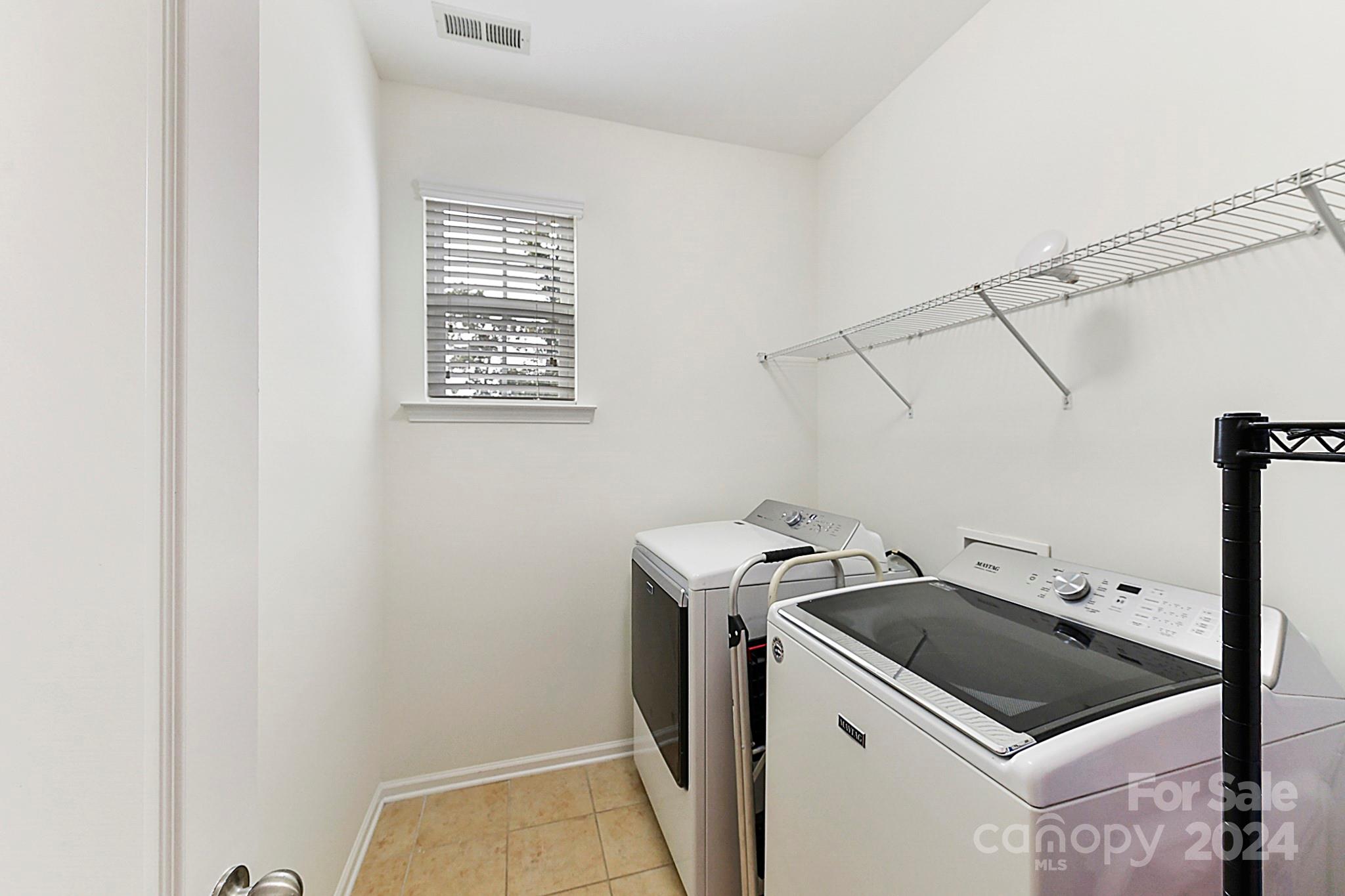 1201 Screech Owl Road Waxhaw, NC 28173 - Photo 20 of 43 a utility room with dryer and washer