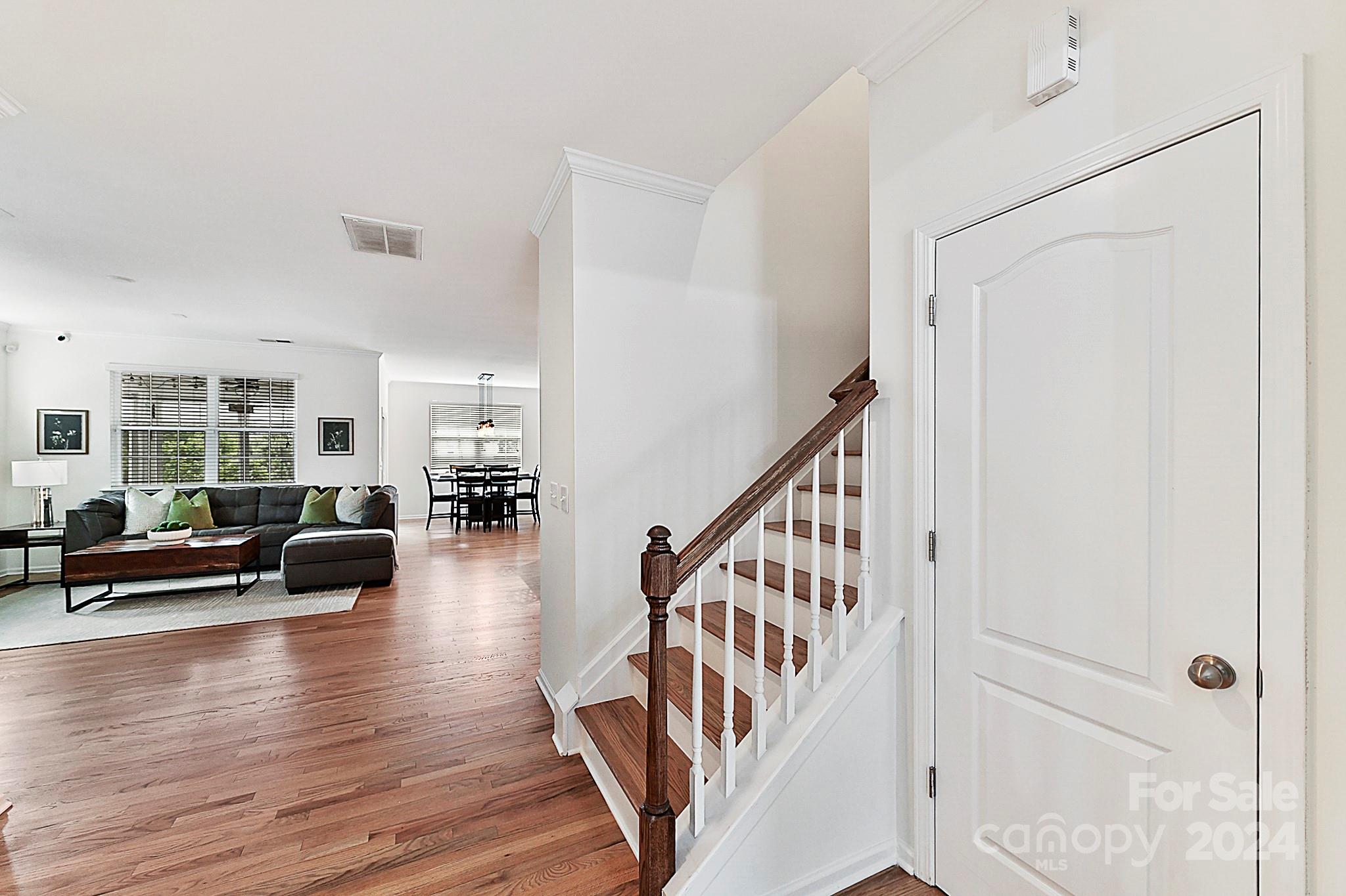 1201 Screech Owl Road Waxhaw, NC 28173 - Photo 21 of 43 a living room with furniture and a wooden floor