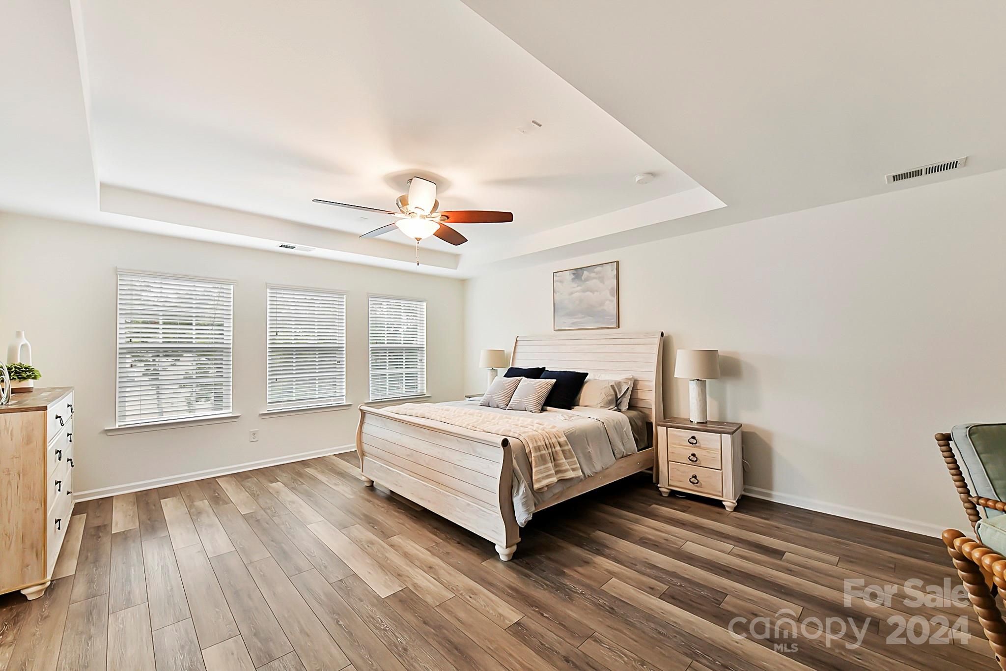 1201 Screech Owl Road Waxhaw, NC 28173 - Photo 23 of 43 a spacious bedroom with a bed and a large window
