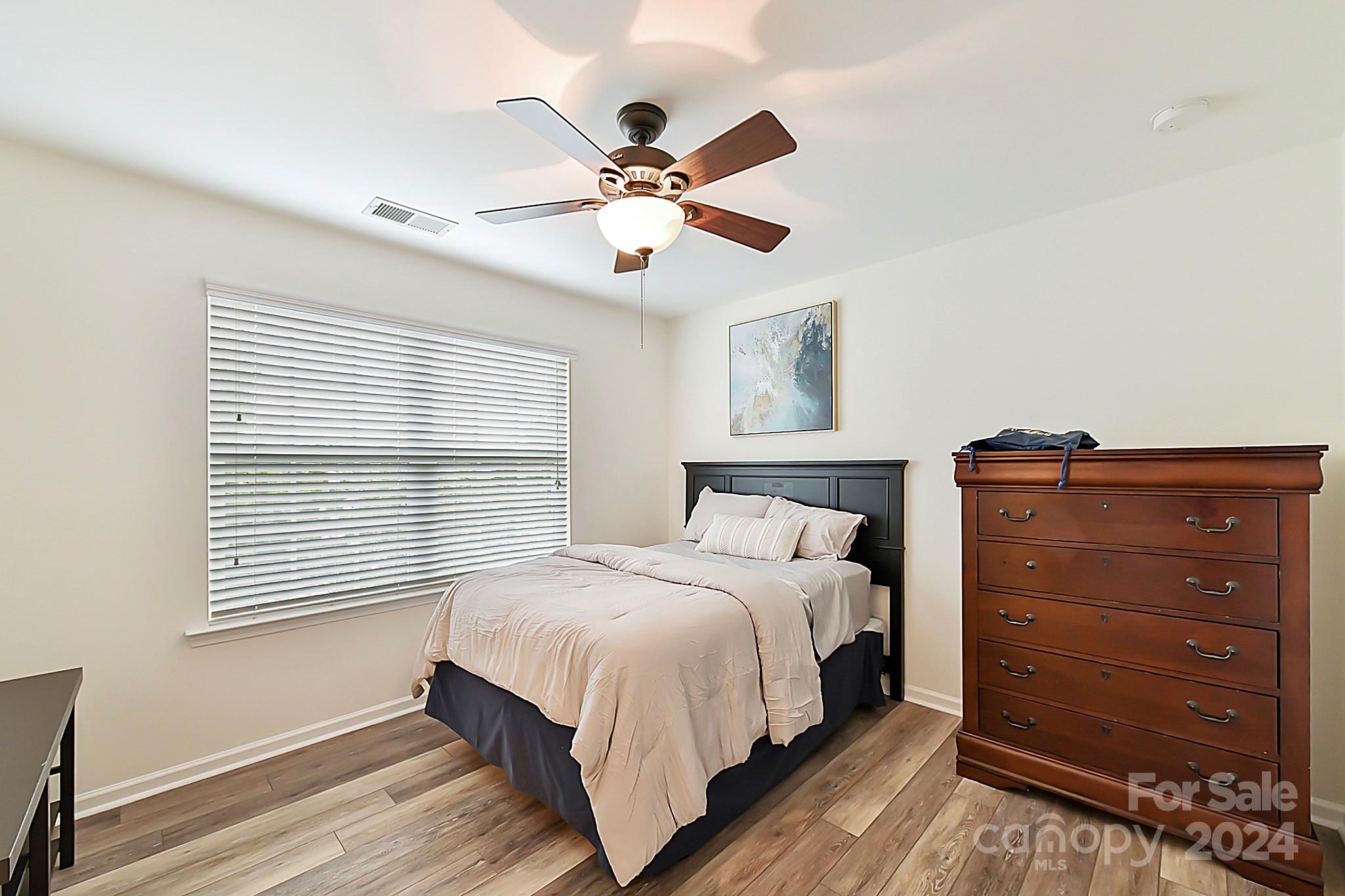 1201 Screech Owl Road Waxhaw, NC 28173 - Photo 30 of 43 a bedroom with a bed and a window