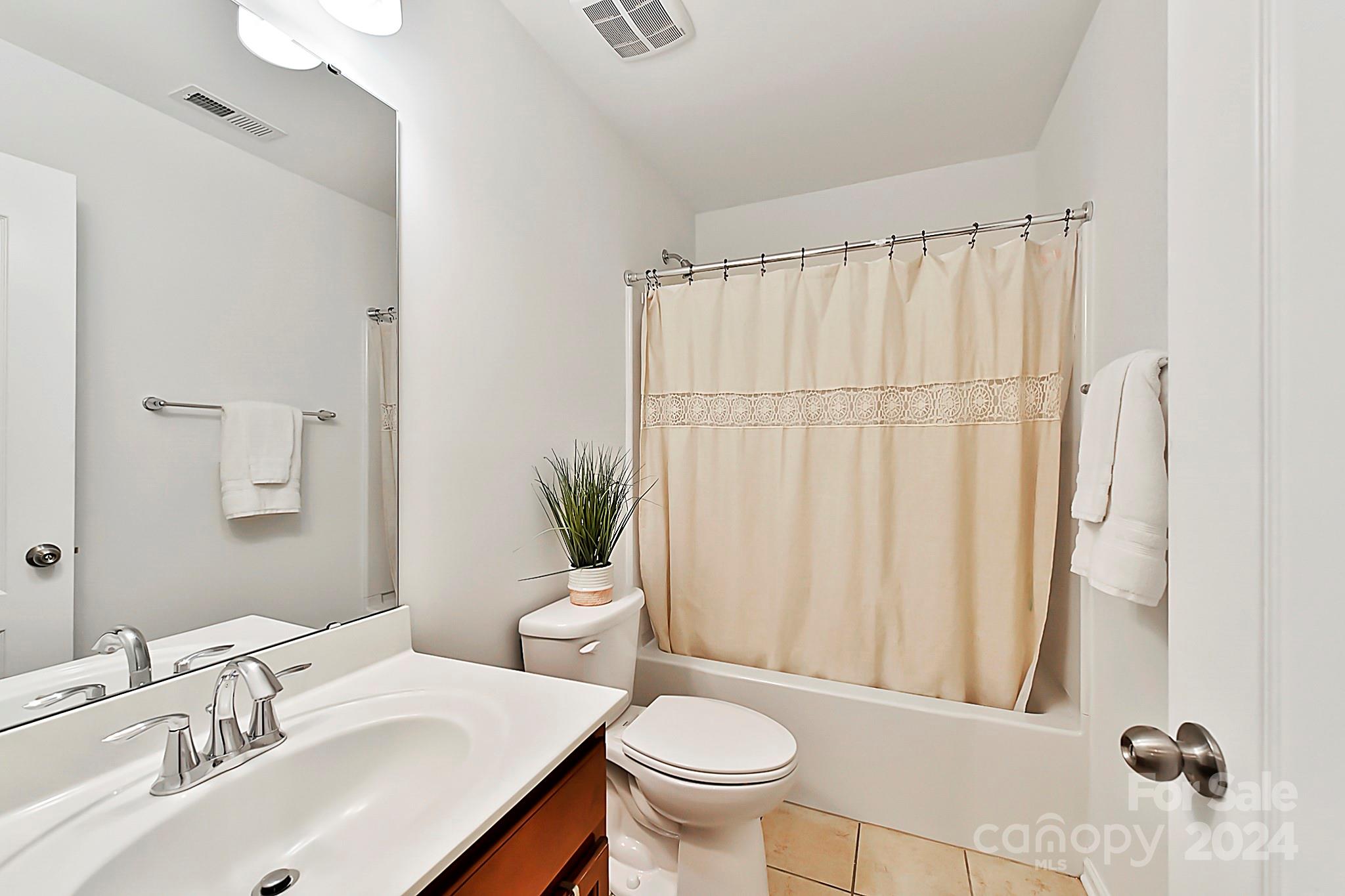 1201 Screech Owl Road Waxhaw, NC 28173 - Photo 31 of 43 a bathroom with a sink toilet and shower